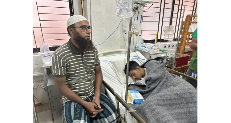 Abid, who passed out of secondary school, is crying in the hospital bed after being shot.