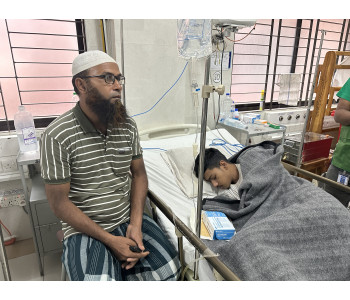 Abid, who passed out of secondary school, is crying in the hospital bed after being shot.